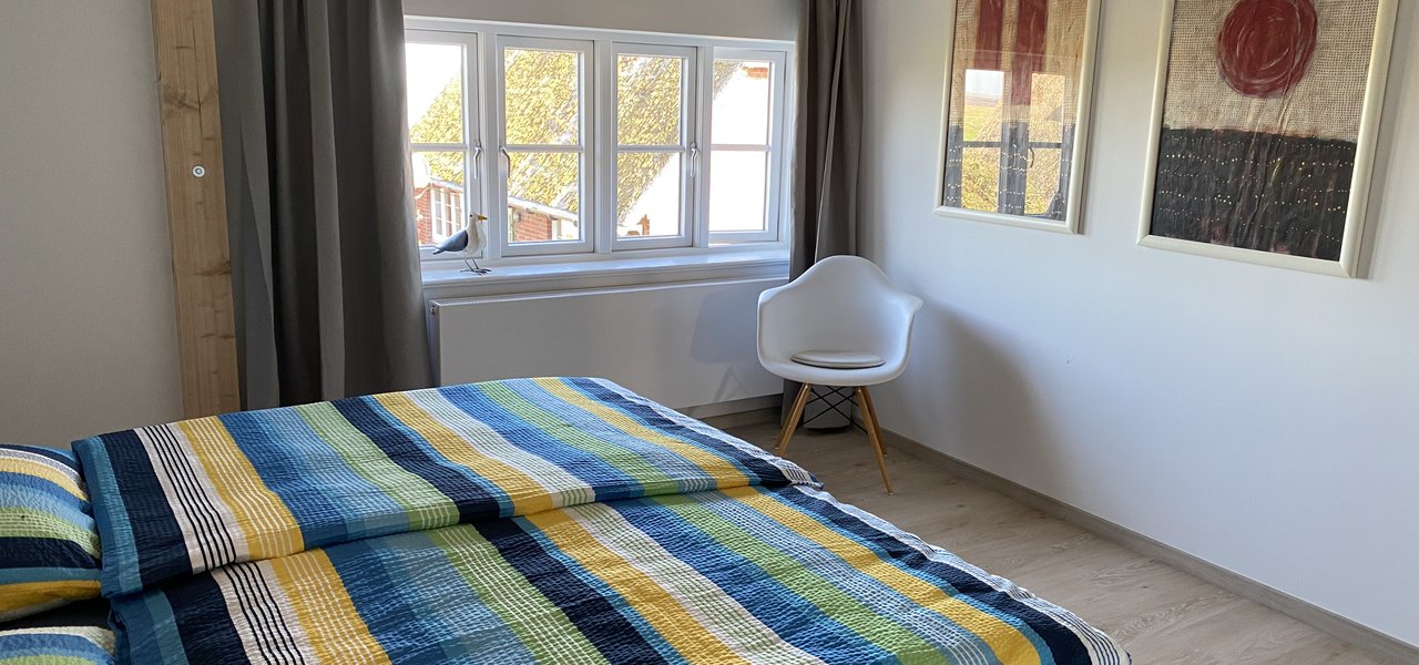 Schlafzimmer in Wohnung Gezeitenblick